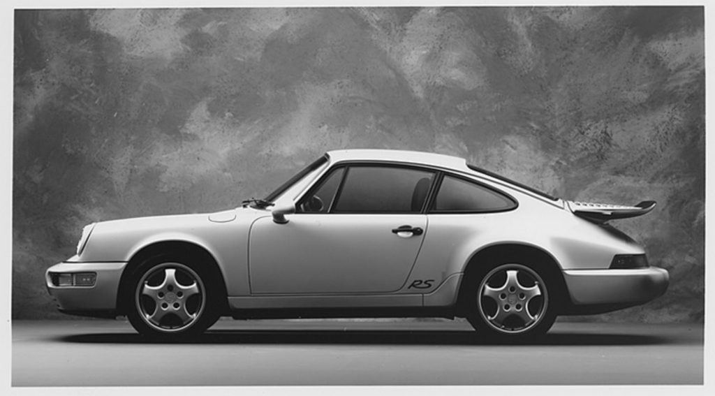 This image is of a Guards Red car and appears in full color on the inside
bottom left hand side of the factory sales brochure.
